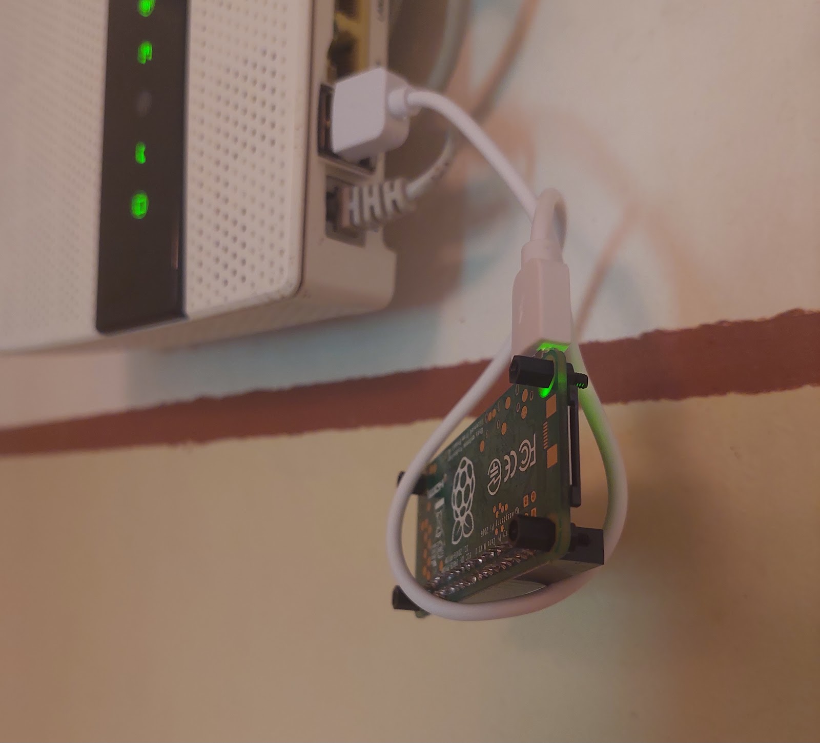 the webshop server: a Raspberry Pi Zero, powered on, cabled to the router